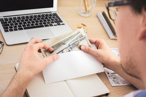 Man with money envelope