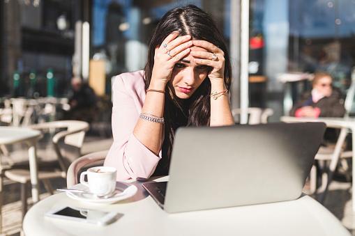 Woman at computer frustrated